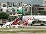  A view of the Frankfurt-to-Delhi Air India flight AI2030 at the Jaipur International Airport following its diversion due to a security threat, in Jaipur on Wednesday. Further probing is underway. 
