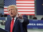 Trump posts bizarre AI video recreating Yorkshire tiger attack, showing POTUS wrestling the animal before hugging it (AP/PTI) (AP10_14_2026_000004B)