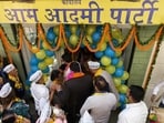 Aam Aadmi Party’s (AAP) Himachal Pradesh in-charge Rituraj Jha and party workers gather outside the newly inaugurated state office at the Bawa Complex on Lower Mall, in Shimla on Tuesday. (ANI Photo)