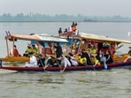 Atheltes take part in a race during 'Jashn-e-Dal' organised to promote tourism in the Valley at Dal Lake in Srinagar on Tuesday. (PTI)