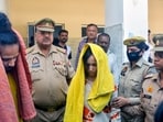 Police take away Merchant Navy officer Saurabh Rajput's wife Muskan and her lover Sahil Shukla after they were arrested in connection with his murder.