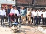 Minister AK Sharman on Wednesday inspects the use of drones for chemical spraying. (Sourced)