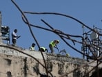 Municipal Corporation of Delhi (MCD) workers demolish a building (Hindustan Times)