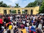 Students stage a protest outside a hostel after a first-year student of the IIIT Ranchi died by suicide.