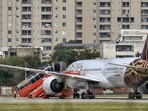 Air India AI2030, operated with a Boeing 787-9 aircraft bearing Vistara's livery, is seen at the isolation bay after making an emergency landing at the Jaipur International Airport following a hijack alert, in Jaipur, Rajasthan.