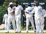 Mohammed Shami celebrates with teammates after taking the wicket of Delhi's Divij Mehra. Mohammed Shami celebrates with teammates after taking the wicket of Delhi's Divij Mehra.