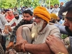Parvinder Singh’s father sitting in protest following the murder in Mansa on Tuesday. (Sanjeev Kumar/HT)