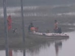 Bihar State Disaster Response Force during a search and rescue operation in the Ganga River following the capsizing of an overcrowded boat near Rampur Shyamchand village in the Raghopur.(ANI Screnngrab)