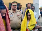 Police take away Merchant Navy officer Saurabh Rajput’s wife Muskan and her lover Sahil Shukla after they were arrested in connection with his murder. 