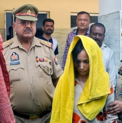 Police take away Merchant Navy officer Saurabh Rajput’s wife Muskan and her lover Sahil Shukla after they were arrested in connection with his murder. 