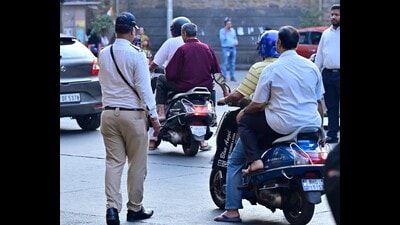 A 10-second video clip, reportedly captured by a car’s dashboard camera, showed at least three motorcyclists skidding on the freshly painted carriageway of the flyover while it was drizzling. (HT Photo) A 10-second video clip, reportedly captured by a car’s dashboard camera, showed at least three motorcyclists skidding on the freshly painted carriageway of the flyover while it was drizzling. (HT Photo)