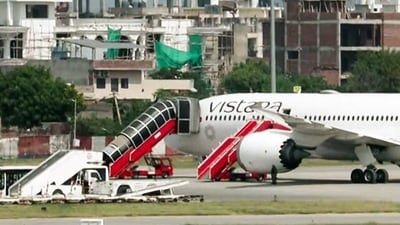 A view of the Frankfurt-to-Delhi Air India flight AI2030 at the Jaipur International Airport following its diversion due to a security threat, in Jaipur on Wednesday. Further probing is underway. (ANI Video Grab) A view of the Frankfurt-to-Delhi Air India flight AI2030 at the Jaipur International Airport following its diversion due to a security threat, in Jaipur on Wednesday. Further probing is underway. (ANI Video Grab)