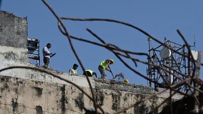 Municipal Corporation of Delhi (MCD) workers demolish a building (Hindustan Times) Municipal Corporation of Delhi (MCD) workers demolish a building (Hindustan Times)