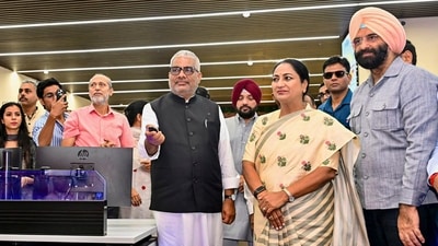 Delhi Chief Minister Rekha Gupta looks on as Union Environment, Forest and Climate Change Minister Bhupender Yadav virtually inaugurates 13 new Continuous Ambient Air Quality Monitoring Stations (CAAQMS), at Delhi Pollution Control Committee's (DPCC) Integrated Command and Control Centre (ICCC). (@byadavbjp/X via PTI Photo) (@byadavbjp)