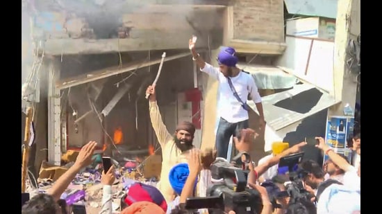 District authorities demolish a portion of the house belonging to Ashwani Kumar, the medical store owner who fatally shot anti-drug activist Parvinder Singh alias Jhota in broad daylight, in Mansa on Wednesday. (PTI)
