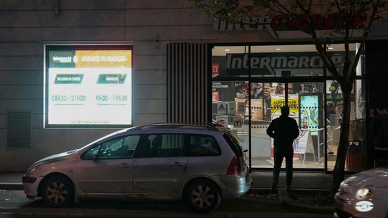 A customer enters an Intermarche supermarket in Issy-les-Moulineaux, on the outskirts of Paris, on October 12, 2026, , following a cyberattack affecting the French supermarket chains Intermarche and Cooperative U that caused their refrigerators to defrost. (AFP)