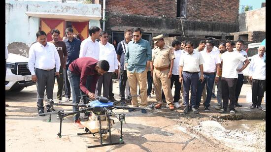 Minister AK Sharman on Wednesday inspects the use of drones for chemical spraying. (Sourced)