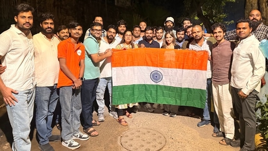 Cockroach Janta Party (CJP) founder Abhijeet Dipke along with party activists pose with the national tricolour following their release after being detained by Delhi Police near Jantar Mantar. (@abhijeet_dipke)