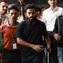 Cockroach Janta Party (CJP) founder Abhijeet Dipke (C) arrives at the Indira Gandhi International Airport in New Delhi on October 14, 2026 amid ongoing protests against India's Chief Election Commissioner Gyanesh Kumar over alleged voter roll irregularities linked to the "special intensive revision" (SIR). (Photo by AFP) / ALTERNATIVE CROP