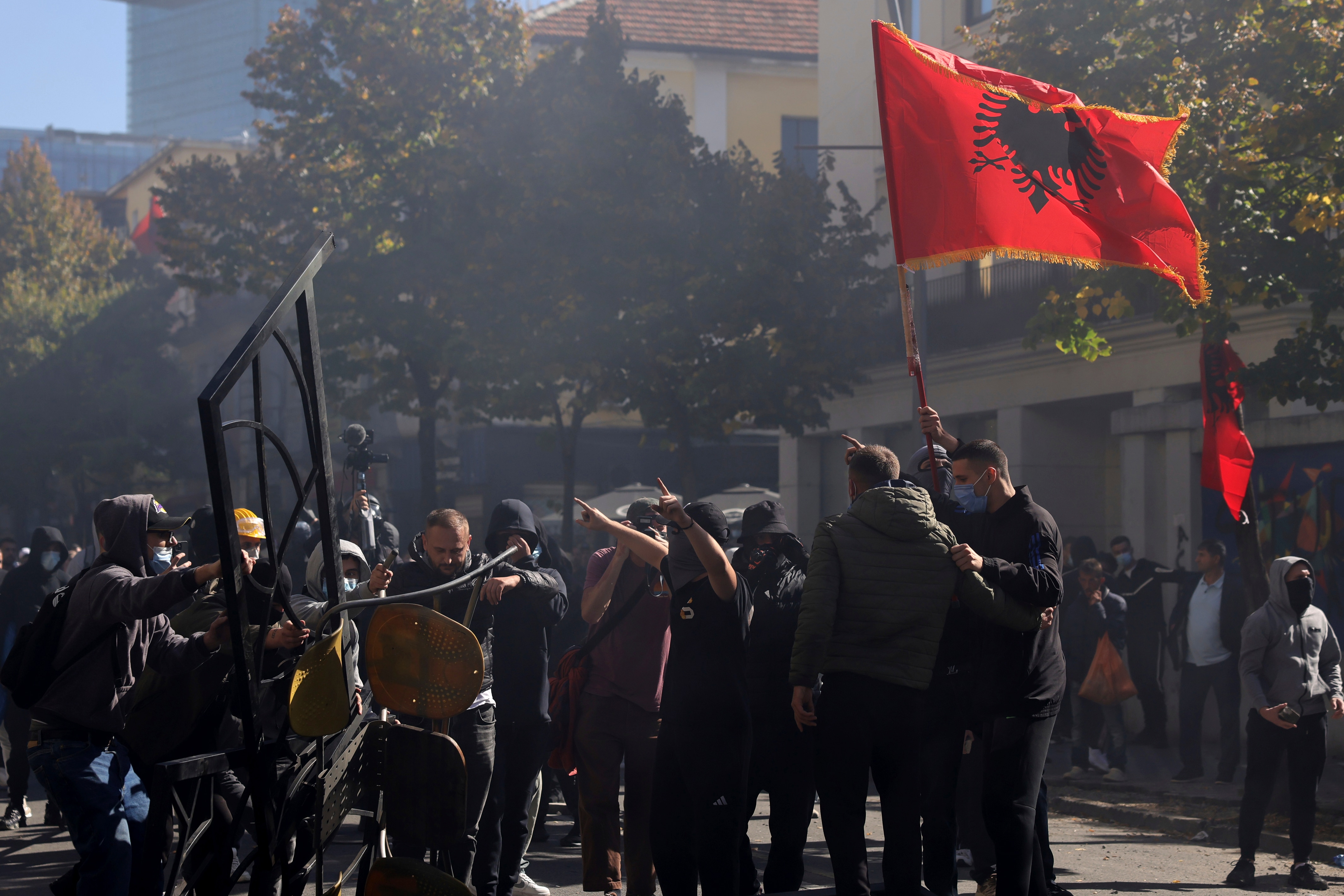 Protesters prepare a barricade during clashes in Tirana, Albania, Wednesday, Oct. 14, 2026, joining a demonstration organized by the Flamingo protest movement demanding the resignation of Prime Minister Edi Rama. (AP Photo/Hameraldi Agolli) (AP Photo/Hameraldi Agolli) Protesters prepare a barricade during clashes in Tirana, Albania, Wednesday, Oct. 14, 2026, joining a demonstration organized by the Flamingo protest movement demanding the resignation of Prime Minister Edi Rama. (AP Photo/Hameraldi Agolli) (AP Photo/Hameraldi Agolli)