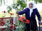 The 117-year-old Qamile Marra poses during an interview in the garden of her home in the village of Ferras, near Kucove, some 80 kilometres from the Albanian capital Tirana. 
