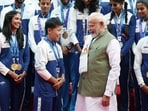 Prime Minister Narendra Modi with wushu silver medallist Roshibina Devi. 