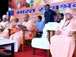 CM Yogi Adityanath at the centenary celebrations organised to mark the completion of 100 years of Bharat Sevashram Sangha’s Kashi branch, in Sigra, Varanasi, on Wednesday. (HT)