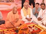 CM Yogi Adityanath performing ‘Bhoomi Pujan’ of a multi-storey residential complex being developed on reclaimed government land in Prayagraj on October 15. (HT photo)