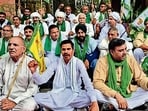 Farmers staging a protest at the new grain market in Karnal on Wednesday. (HT Photo)