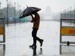 Gram it: Delhi’s weather took a rainy turn on Thursday as IMD issued an Orange alert for moderate to intense showers. Here's how a daily commuter made his way through the rain, near India Gate. The Capital is likely to see cloudy skies and light rain today as well. (Photo: Ravi Choudhary/PTI)
