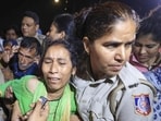 Police personnel detain parents of 19-year-old Ankita Bhandari, who was murdered in Uttarakhand in 2022, while protesting near India Gate against Dushyant Kumar Gautam’s appointment as Sikkim governor, in New Delhi (@INCIndia)