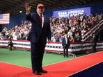 US President Donald Trump waves during an election rally at Majestic Valley Arena on Thursday.