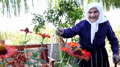 The 117-year-old Qamile Marra poses during an interview in the garden of her home in the village of Ferras, near Kucove, some 80 kilometres from the Albanian capital Tirana. (AFP) The 117-year-old Qamile Marra poses during an interview in the garden of her home in the village of Ferras, near Kucove, some 80 kilometres from the Albanian capital Tirana. (AFP)
