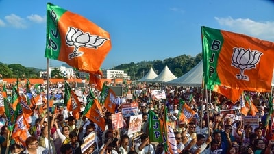 BJP supporters hold party flags (ANI/File photo) BJP supporters hold party flags (ANI/File photo)