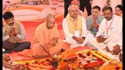 CM Yogi Adityanath performing ‘Bhoomi Pujan’ of a multi-storey residential complex being developed on reclaimed government land in Prayagraj on October 15. (HT photo)