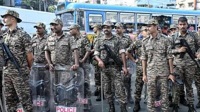 Central Reserve Police Force (CRPF) personnel stand guard during a protest by the All India Trinamool Congress (TMC) party demanding the resignation of tthe country's chief election commissioner Gyanesh Kumar over alleged voter roll irregularities linked to the special intensive revision , in Kolkata on October 13 (AFP FILE)