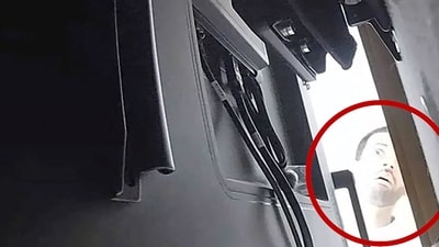 A man described as Abdulrahman Alfozan, a Saudi national employed as an OpenAI engineer, looks behind a television where a recording device had been placed at a conference room in OpenAI offices, in a still image from surveillance video included in a charging document after US federal agents the man and charged him with installing a hidden audio recording device, in San Francisco, California, US, October 5, 2026. (via REUTERS)