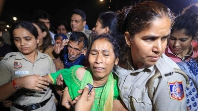 Police personnel detain the mother of 19-year-old Ankita Bhandari, who was murdered in Uttarakhand in 2022, while protesting near India Gate against Dushyant Kumar Gautam's appointment as Sikkim governor, in New Delhi. (@INCIndia/X) Police personnel detain the mother of 19-year-old Ankita Bhandari, who was murdered in Uttarakhand in 2022, while protesting near India Gate against Dushyant Kumar Gautam's appointment as Sikkim governor, in New Delhi. (@INCIndia/X)