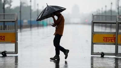 Gram it: Delhi’s weather took a rainy turn on Thursday as IMD issued an Orange alert for moderate to intense showers. Here's how a daily commuter made his way through the rain, near India Gate. The Capital is likely to see cloudy skies and light rain today as well. (Photo: Ravi Choudhary/PTI)