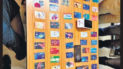 The seized ATM cards in police custody on Thursday. (HT Photo)