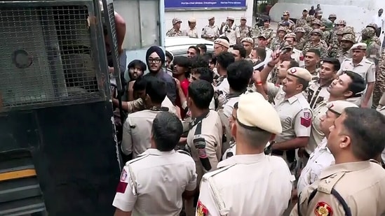 New Delhi, Oct 10 (ANI): Delhi Police detain protesters near Connaught Place amid the CJP protest, in New Delhi on Saturday. (ANI Video Grab)