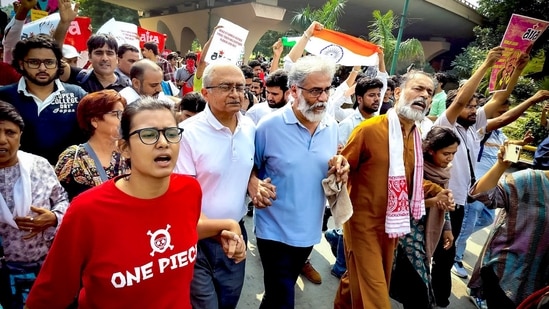 All India Students' Association (AISA) National President Neha Bora, advocate Prashant Bhushan, activist Yogendra Yadav, and CPI(ML) Liberation General Secretary Dipankar Bhattacharya lead a march near INA Market towards Jantar Mantar on October 10
