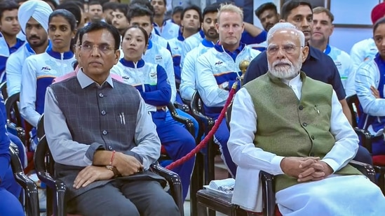 Prime Minister Narendra Modi and Union Sports and Youth Affairs Minister Mansukh Mandaviya during an interaction programme with the athletes of the Asian Games 2026, in New Delhi.