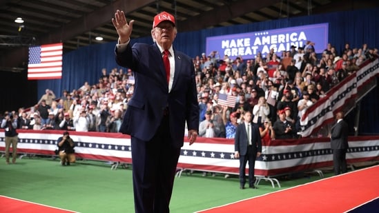 US President Donald Trump waves during an election rally at Majestic Valley Arena on Thursday.