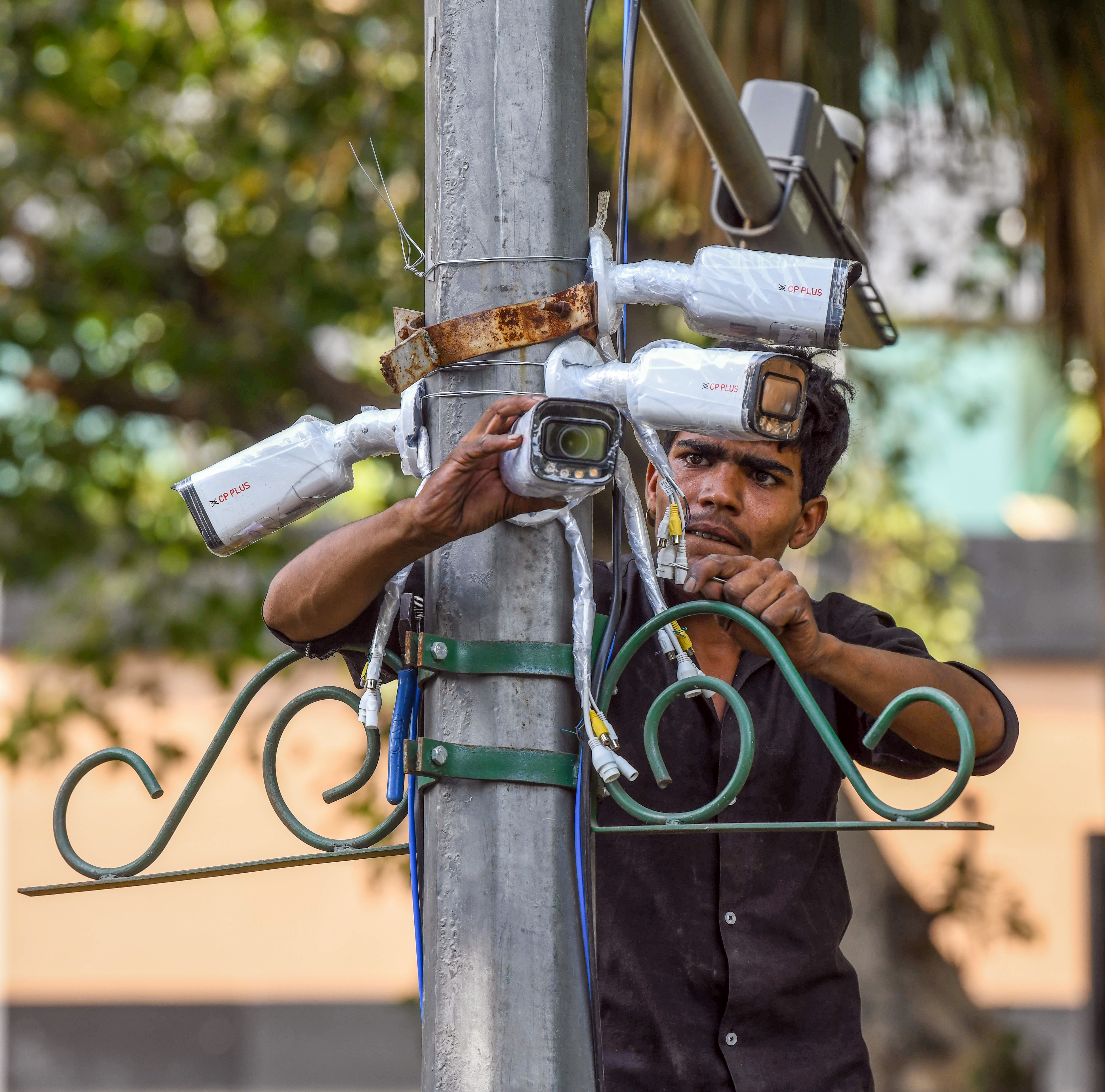 A man installing CCTV cameras near Jantar Mantar ahead of the Cockroach Janta Party's (CJP) protest scheduled for Oct 10 (ANI) A man installing CCTV cameras near Jantar Mantar ahead of the Cockroach Janta Party's (CJP) protest scheduled for Oct 10 (ANI)