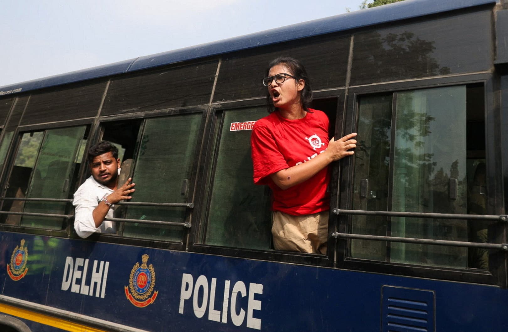 Neha Bora, National President of the All India Students' Association (AISA), shouts from a police vehicle after being detained during a protest organised by the Cockroach Janta Party (CJP) seeking the resignation of India's Chief Election Commissioner, Gyanesh Kumar (REUTERS)