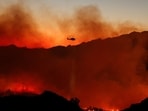 California faces fresh wildfire threat as Malibu fire spreads amid strong Santa Ana winds.