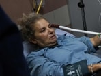 American freelance photojournalist Heidi Levine lies on a gurney in the emergency room of the government hospital in the Israeli-occupied city of Ramallah, as she is treated after being attacked by Israeli settlers while photographing Palestinian farmers harvesting their olives, in the Palestinian village of Abu Falah on October 16.