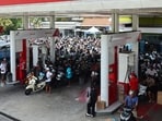 Motorcyclists queue to refuel at state-own petrol station Pertamina amid fuel supply shortage in Badung, Bali, Indonesia, October 15, 2026. REUTERS/Johannes Christo