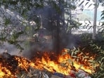 In Manesar’s industrial areas, residents have also complained of household waste being dumped alongside industrial waste in vacant plots. The waste is often burnt during the day or at night, generating smoke and creating an additional pollution source in surrounding areas. (HT Archive)